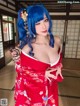A woman in a red kimono posing for a picture.